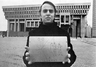 Carl Sagan holding the Pioneer plaque.