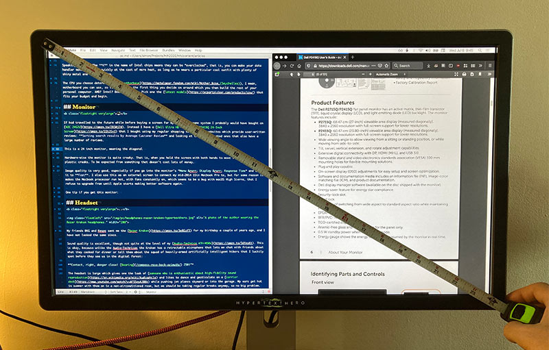 A photo of the Dell P2415Q monitor with a measuring tape placed diagonally across the screen.