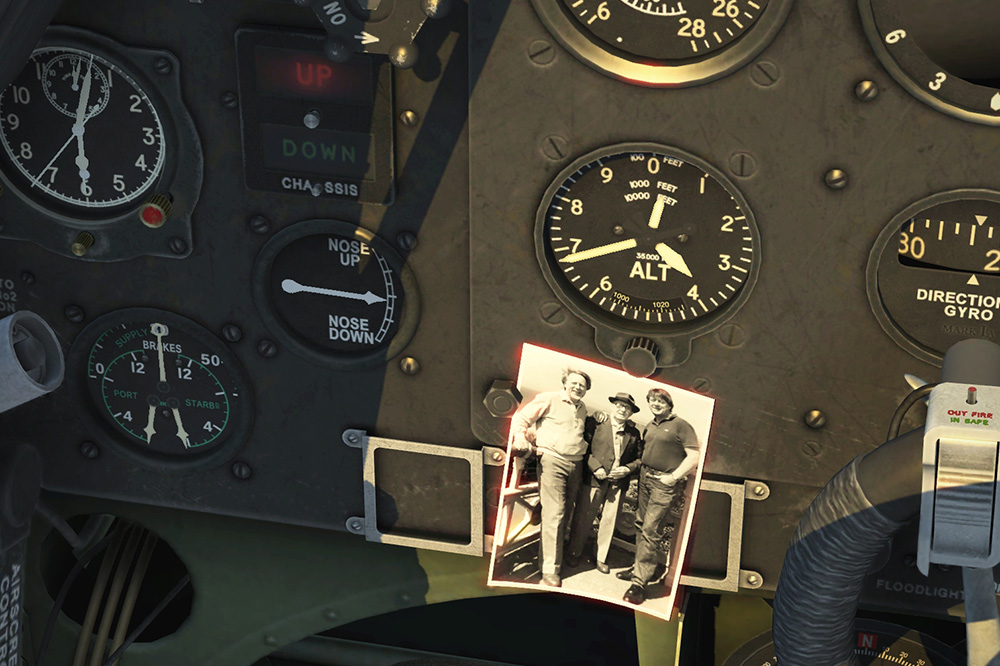 Spitfire cockpit with a photo of Alan, Frank and Peter.